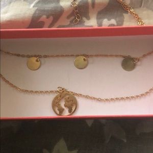 Double chain necklace with world map pendant